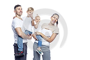 Happy family with children. Mom, dad, daughter and son in white T-shirts hug and laugh. Love and tenderness. Isolated on a white