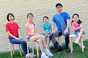 Happy family with children outdoors during summer