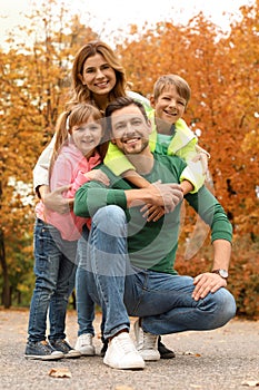 Happy family with children spending time together in park