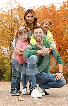 Happy family with children spending time together in park