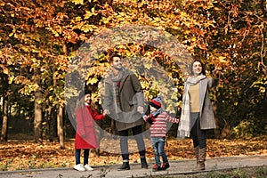 Happy family with children spending time together in park