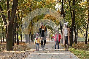 Happy family with children spending time together in park