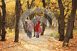 Happy family with children spending time together in park