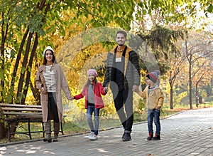 Happy family with children spending time together in park