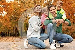 Happy family with children together in park