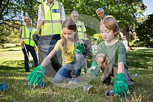 Happy family collecting rubbish