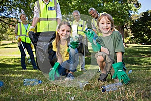 Happy family collecting rubbish