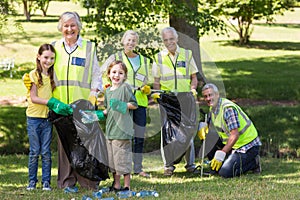 Happy family collecting rubbish