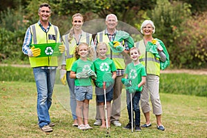 Happy family collecting rubbish