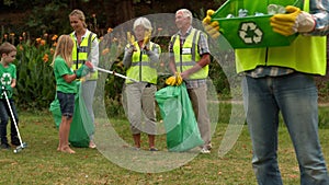 Happy family collecting rubbish