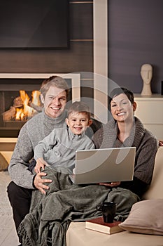 Happy family with computer