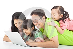 Happy family with computer