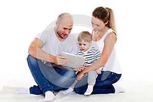 Happy family with computer tablet.