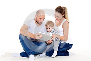 Happy family with computer tablet.