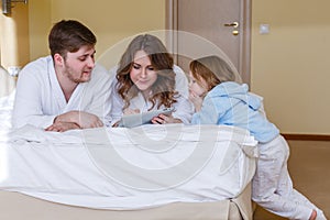 Happy family with computer tablet.