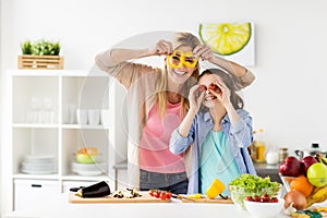 Happy family cooking dinner at home kitchen