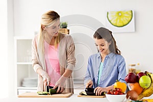 Happy family cooking dinner at home kitchen