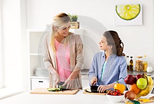 Happy family cooking dinner at home kitchen