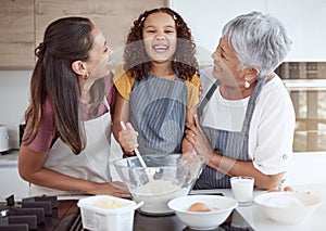 Happy family, cooking and learning with smiling girl bonding with her mother and grandmother in a kitchen. Love