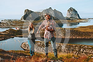 Happy family couple traveling with baby hiking outdoor