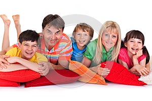 Happy family on cushions photo