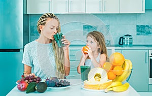 Happy family. Cute child eating breakfast at home. Eating and Healthy food. Healthy Lifestyle. Mother and child girl