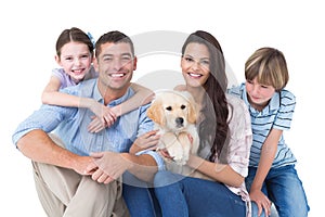 Happy family with cute dog over white background