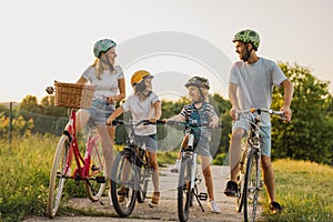 Happy family cycling together