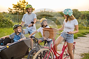 Happy family cycling together