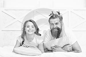 happy family of dad and daughter having fun at home with funny hairdo, fathers day