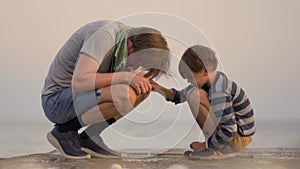 Happy family dad with son play together. Father and child spend time together in nature