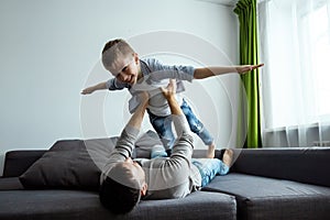 Happy family, Dad and son spend time together, fooling around. Concept of happy father`s day, family enthusiasm, spend time