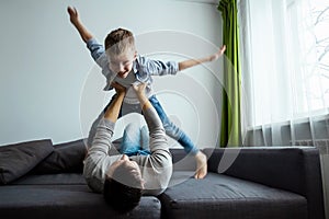 Happy family, Dad and son spend time together, fooling around. Concept of happy father`s day, family enthusiasm, spend time