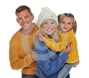 Happy family with daughter in warm sweaters on white background. Winter season