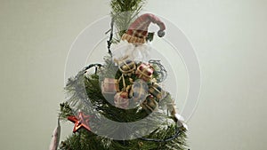 Happy family decorating a Christmas tree with boubles in the living-room