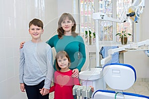 A happy family in a dental office. A family visit to a dentist