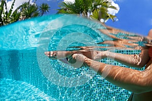 Happy family dive underwater with fun in swimming pool