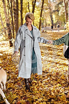 Happy family with dog walk in park together. Family, leisure and people concept