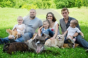 Happy family with dogs and cat