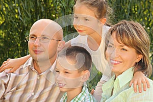 Happy family in early fall park