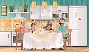 Happy family eating in the kitchen. Father, mother, son and daughter have breakfast at the table at home