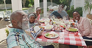 Happy family eating together at table