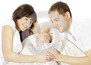 Happy family embracing sleeping newborn baby