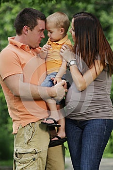 Happy family enjoy summer day in the park.