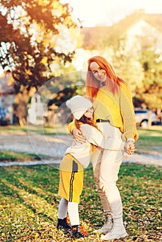 Happy family enjoying autumn day together. Family autumn walk. Autumn holidays, lifestyle, childhood