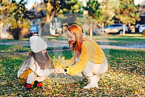 Happy family enjoying autumn day together. Family autumn walk. Autumn holidays, lifestyle, childhood