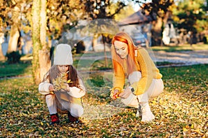 Happy family enjoying autumn day together. Family autumn walk. Autumn holidays, lifestyle, childhood