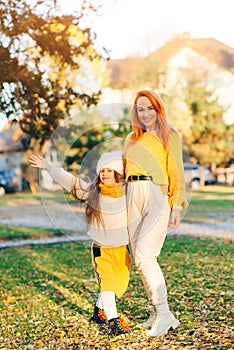 Happy family enjoying autumn day together. Family autumn walk. Autumn holidays, lifestyle, childhood