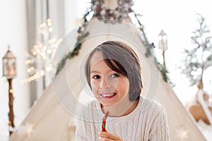 Happy family, enjoying christmas together in cozy home, decorated