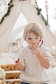 Happy family, enjoying christmas together in cozy home, decorated